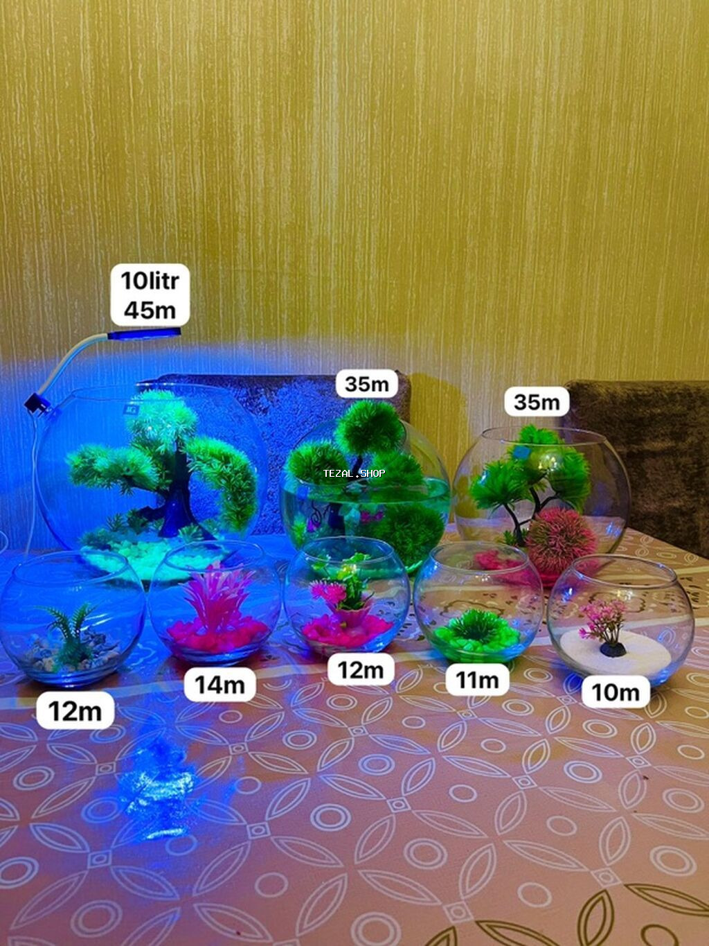 Yumru akvarium müxtəlif ölçülərdədi.içinin daşı dekoru daxildir