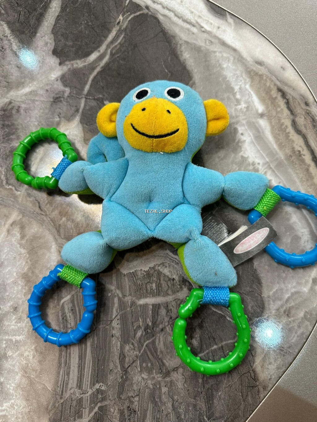 Usaq oyuncagi.Kalyaskadan ve besikden asilir.Her halqasindan asmaq