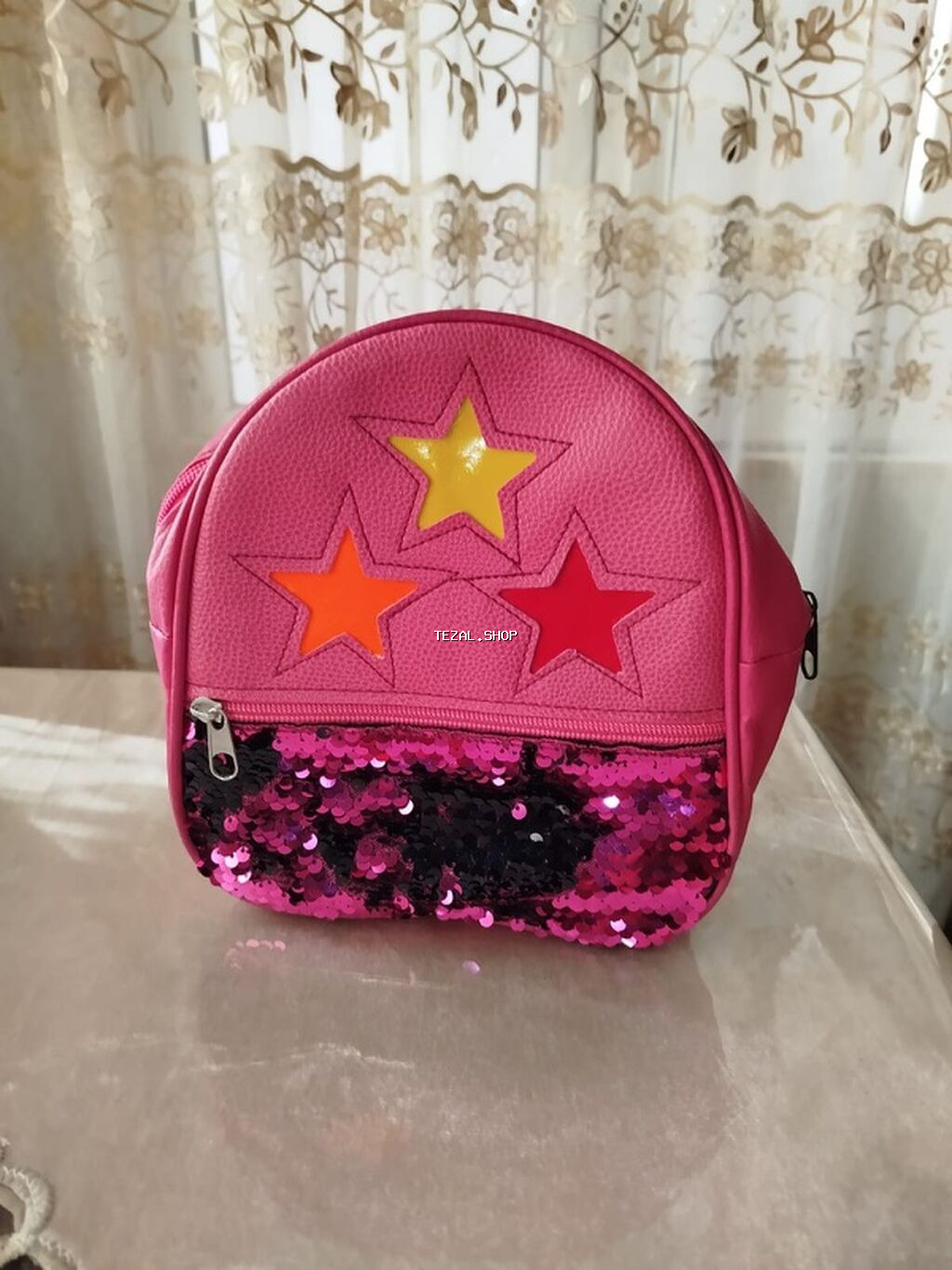 Ulduz və parlaq detallarla bəzədilmiş çəhrayı uşaq bel çantası