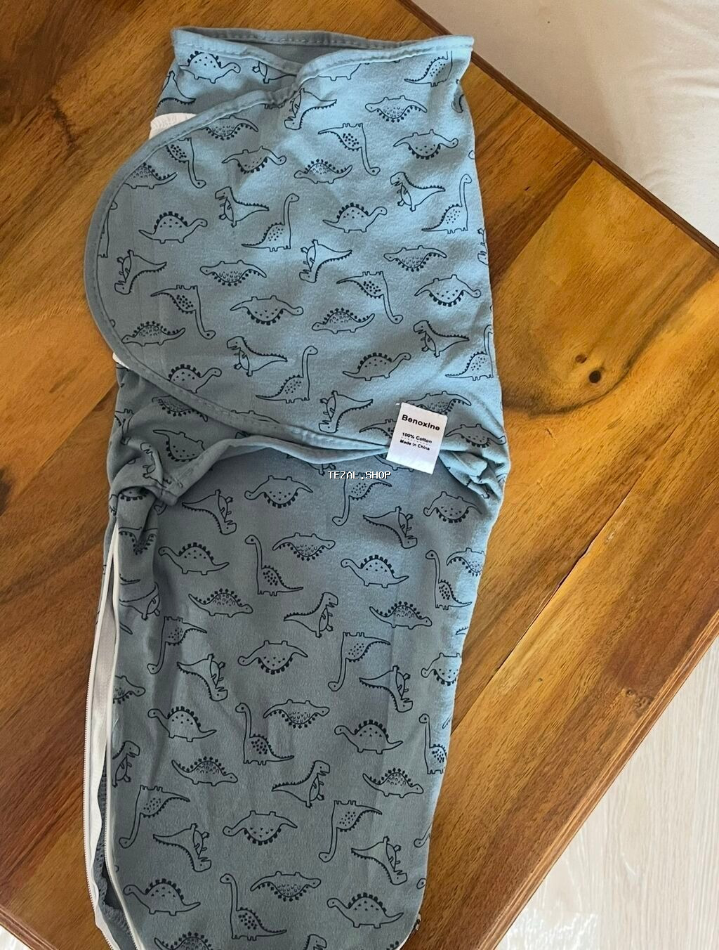 Bələk yenidoğulandan ki,uşaq yatanda diksinib,əlini üzünə aparıb