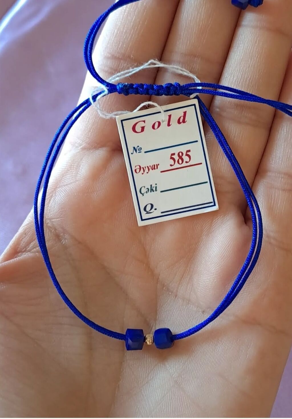 Məhsul: 585 əyarlı qızıl detallı ipli bilərzik - Material: parlaq