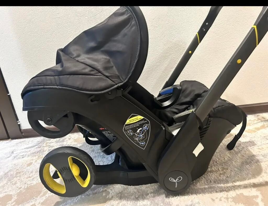 Doona tipli avtomobil oturacağı arabası təkərlərə malik uşaq avtomobil